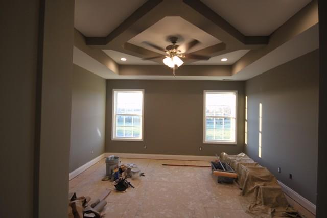 5625 Flewellyn Road Springfield, TN 37172 - Photo 10 of 13 a spacious bedroom with a bed and a chandelier