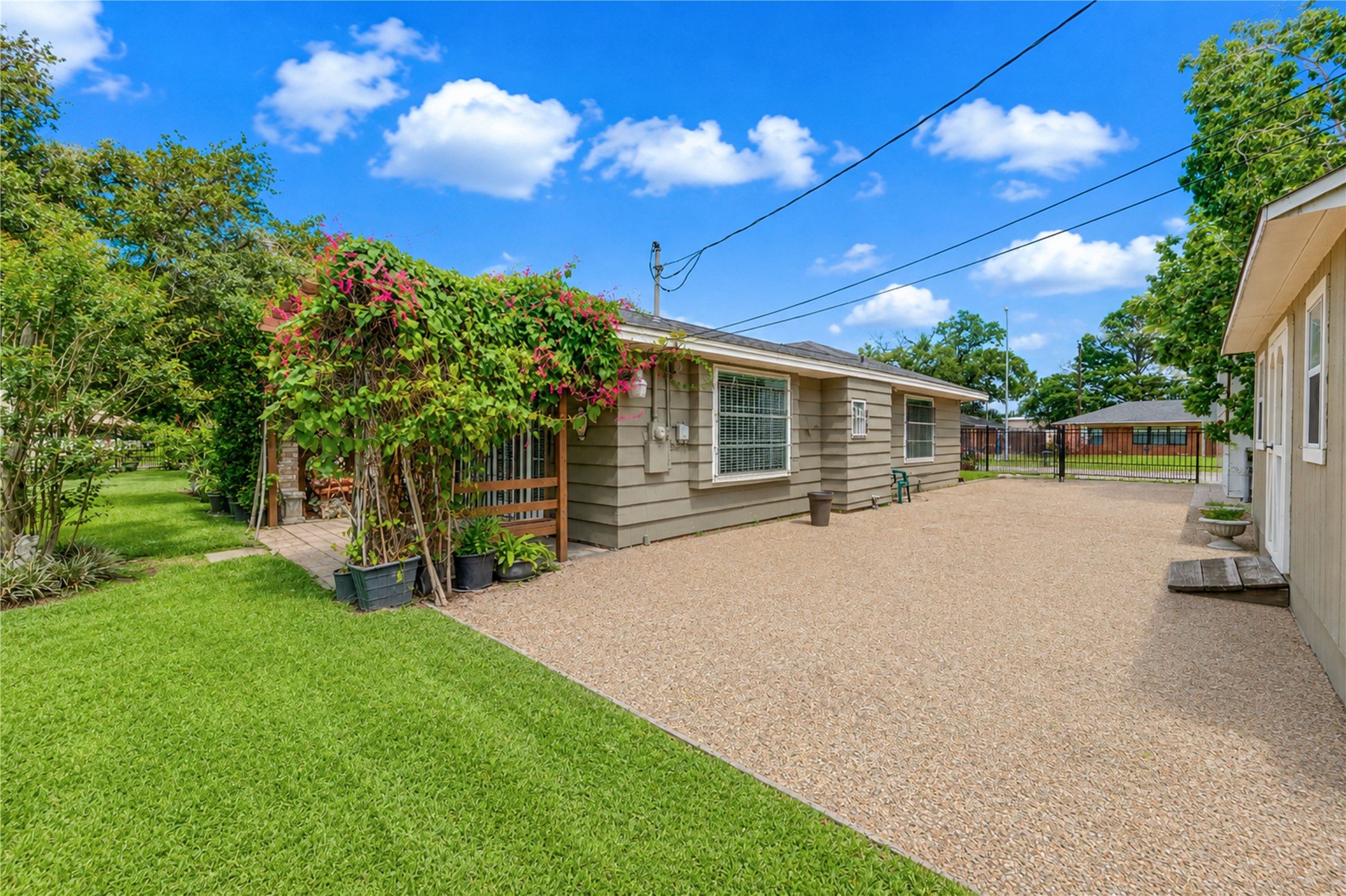 4018 Blalock Road Houston, TX 77080 - Photo 32 of 35 Nestled to the side is a picturesquecovered patio area surrounded by beautiful plants and stunning grapevine.
