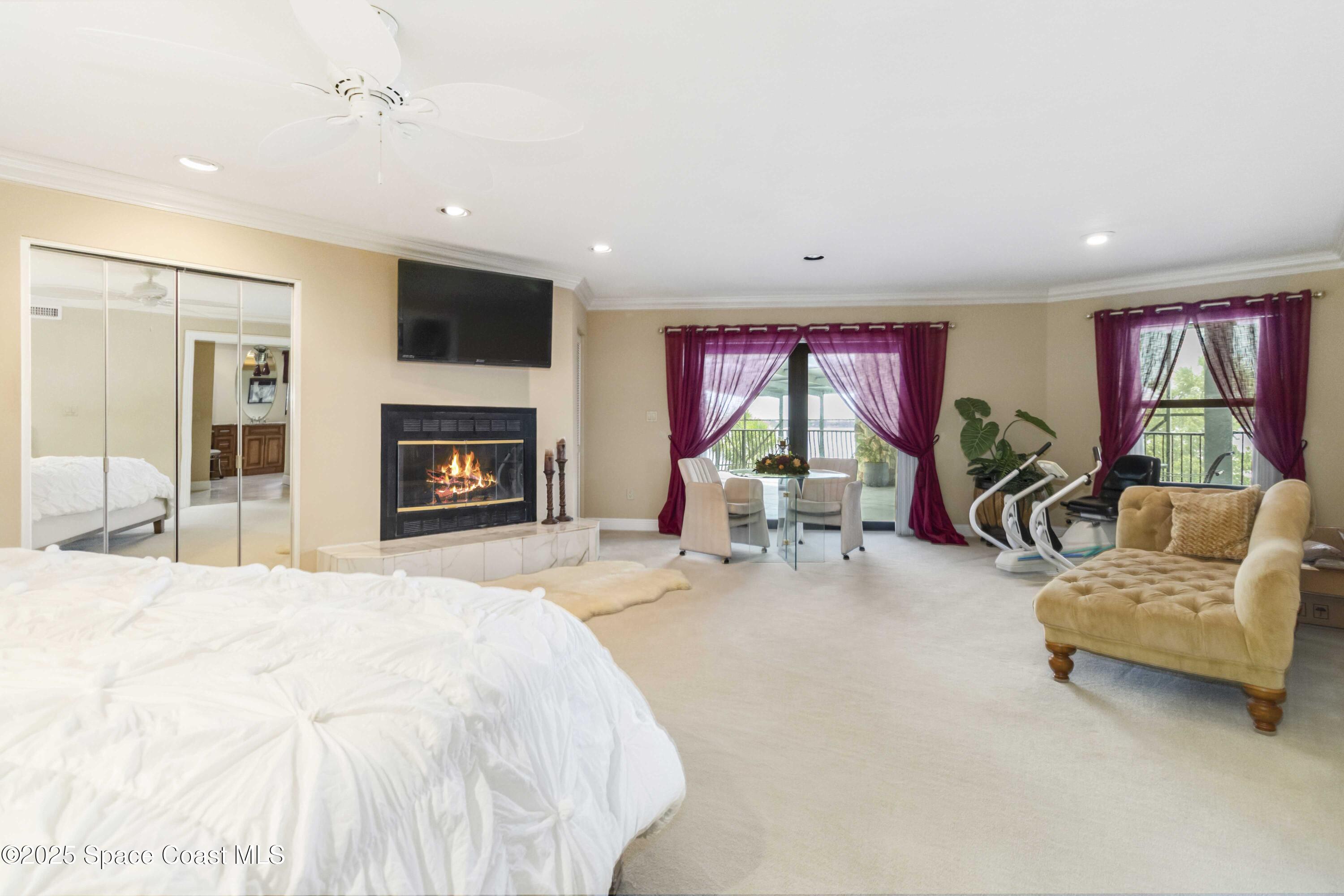 110 Barnacle Place Rockledge, FL 32955 - Photo 18 of 73 a living room with furniture flat screen tv and a fireplace