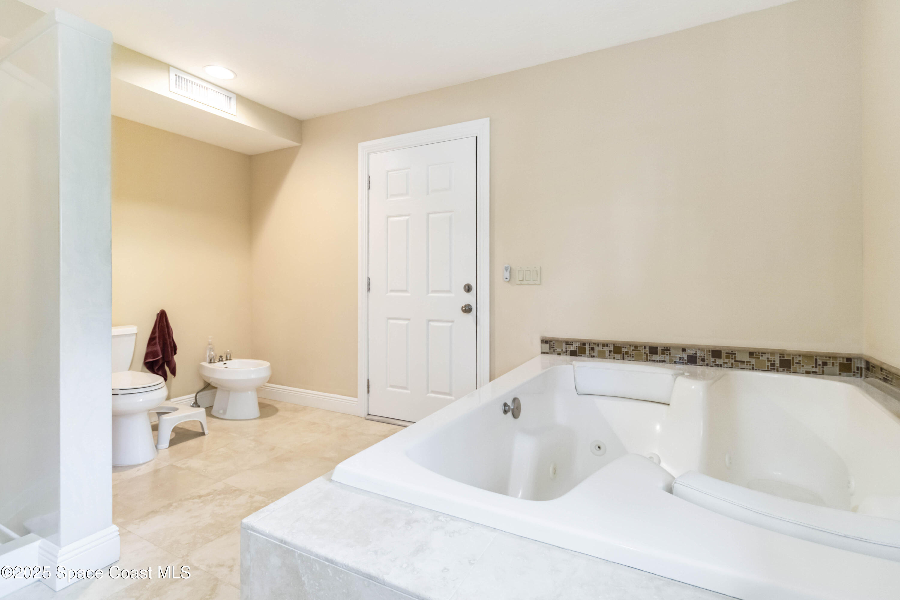 110 Barnacle Place Rockledge, FL 32955 - Photo 21 of 73 a bathroom with a bathtub and a toilet