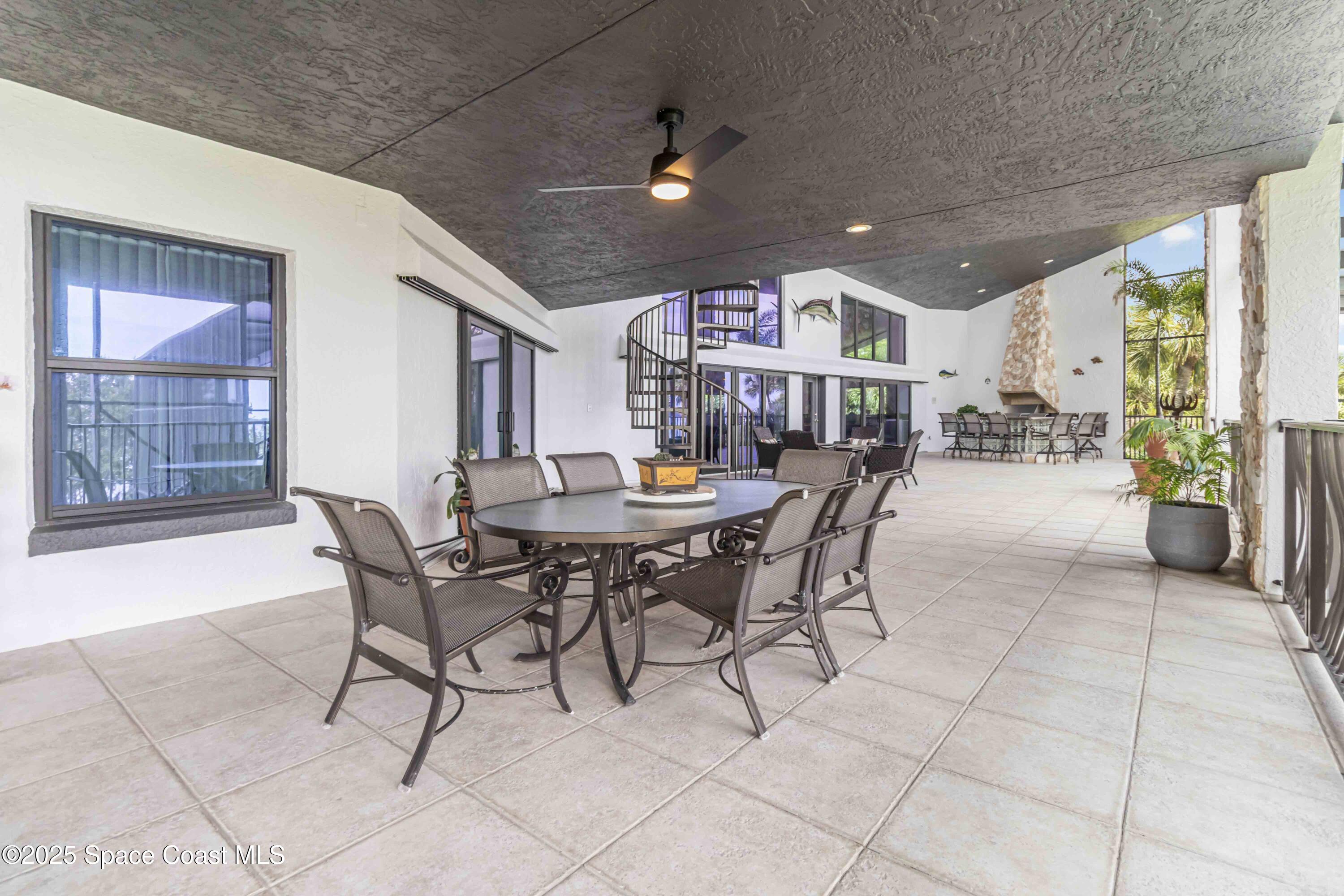 110 Barnacle Place Rockledge, FL 32955 - Photo 28 of 73 a view of a dining room with furniture and a potted plant