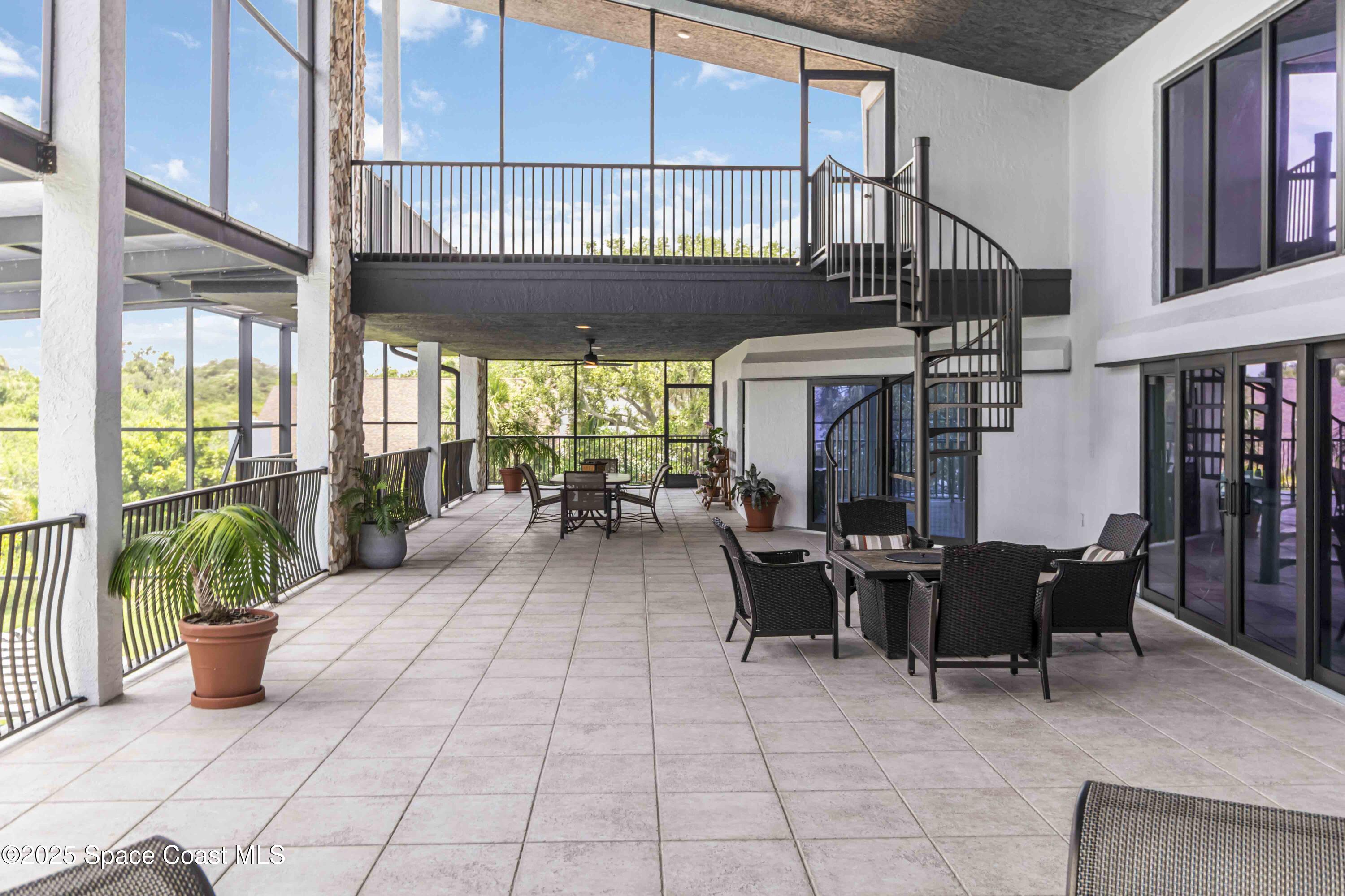 110 Barnacle Place Rockledge, FL 32955 - Photo 34 of 73 a view of a patio with a table and chairs in patio