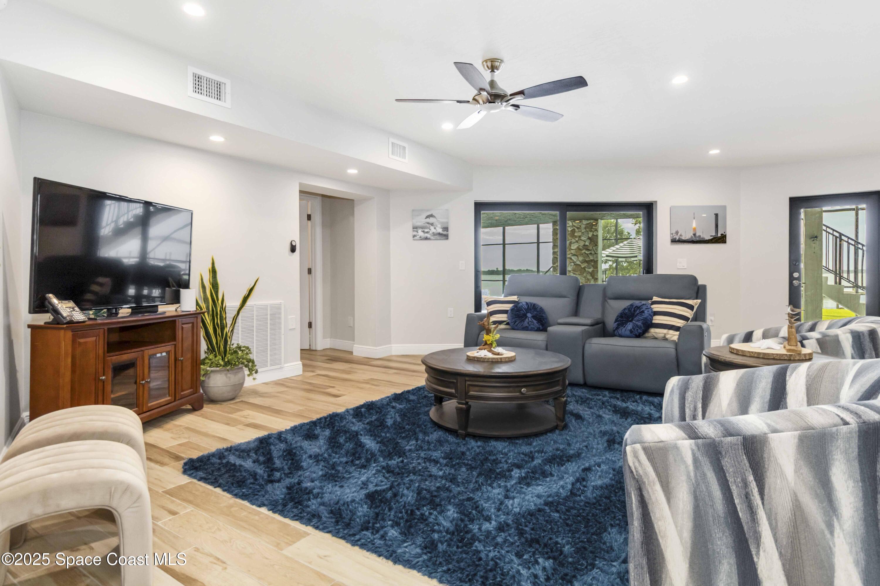 110 Barnacle Place Rockledge, FL 32955 - Photo 37 of 73 a living room with furniture and a flat screen tv