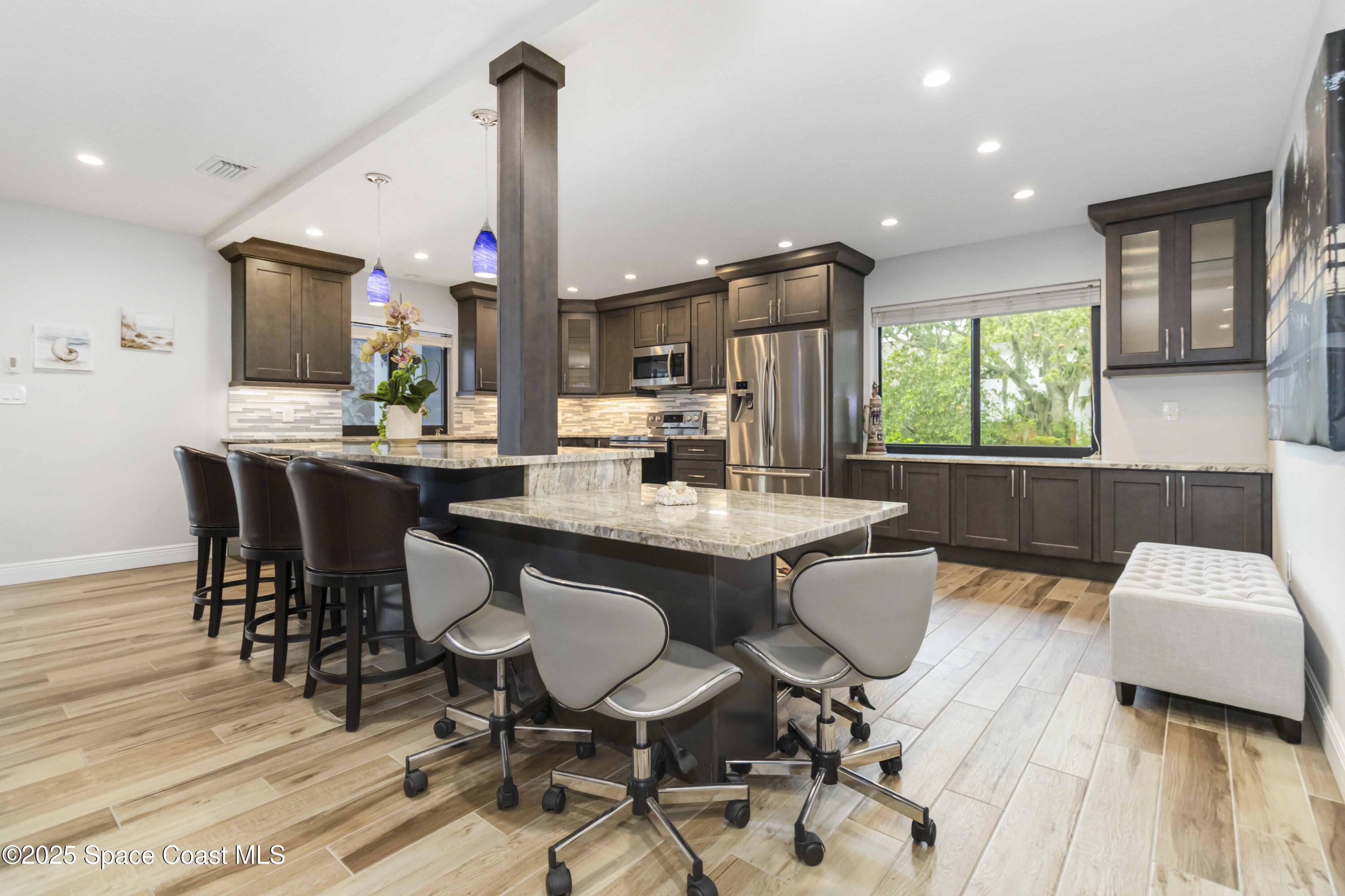 110 Barnacle Place Rockledge, FL 32955 - Photo 42 of 73 a view of a dining room with furniture and a window