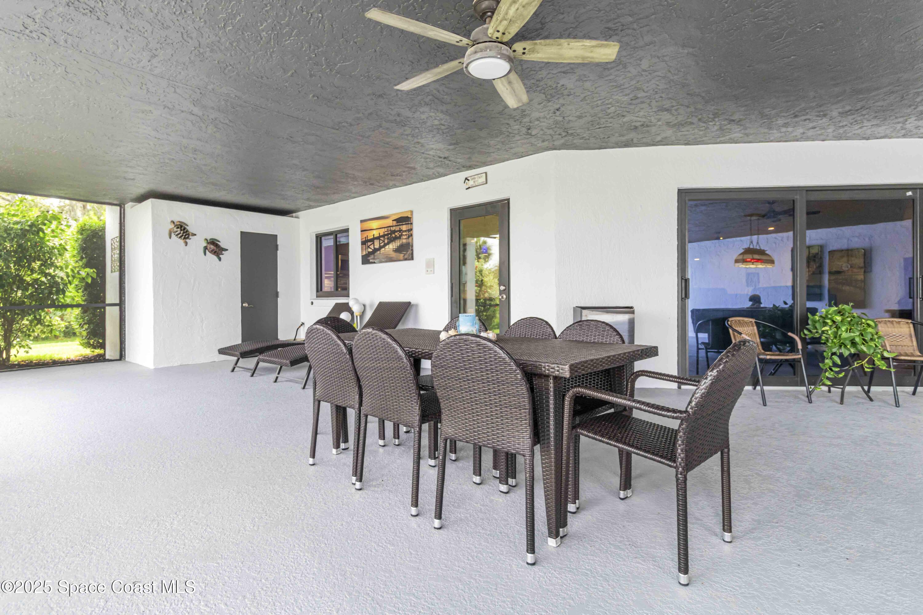 110 Barnacle Place Rockledge, FL 32955 - Photo 49 of 73 a view of a dining room with furniture and window