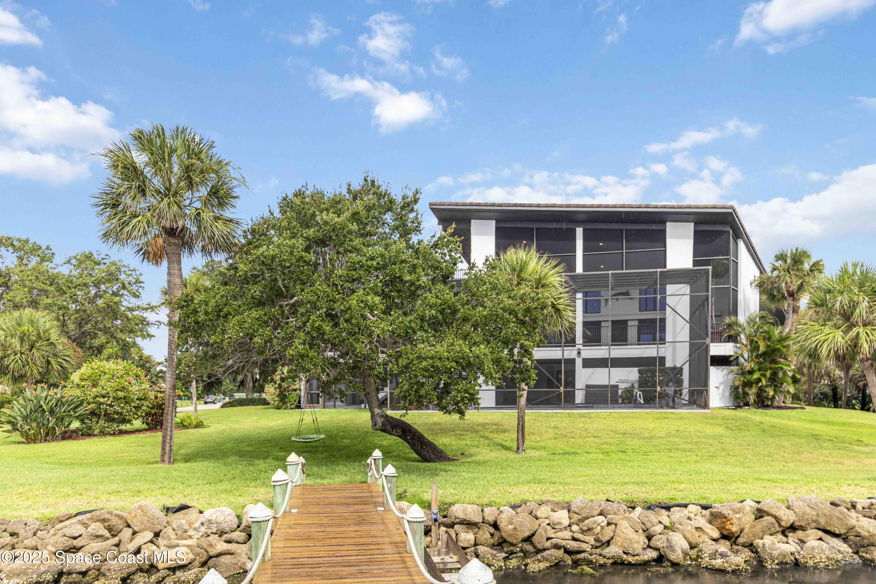 110 Barnacle Place Rockledge, FL 32955 - Photo 60 of 73 a view of a house with a yard