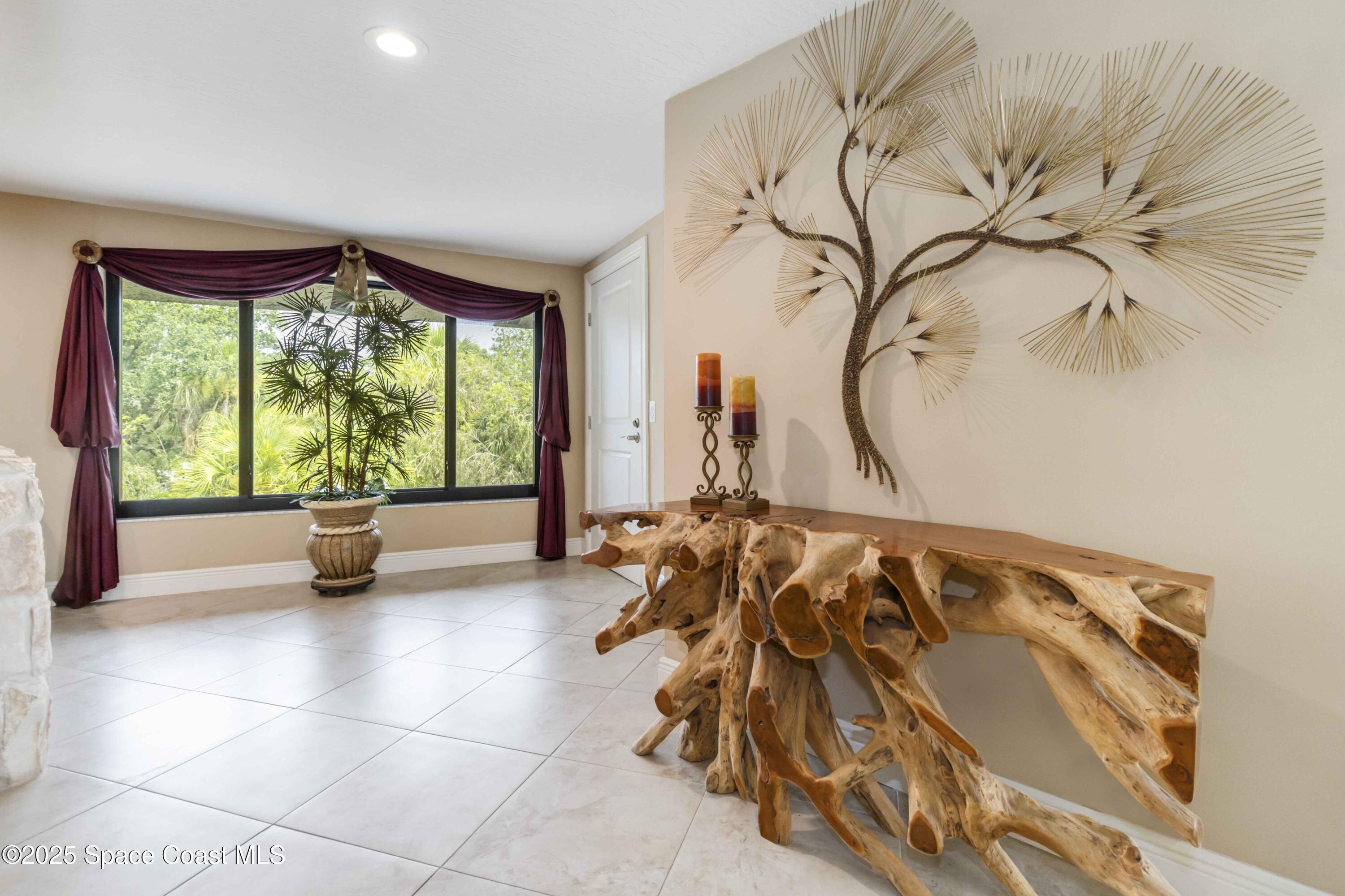 110 Barnacle Place Rockledge, FL 32955 - Photo 6 of 73 a bed sitting in a room next to a window