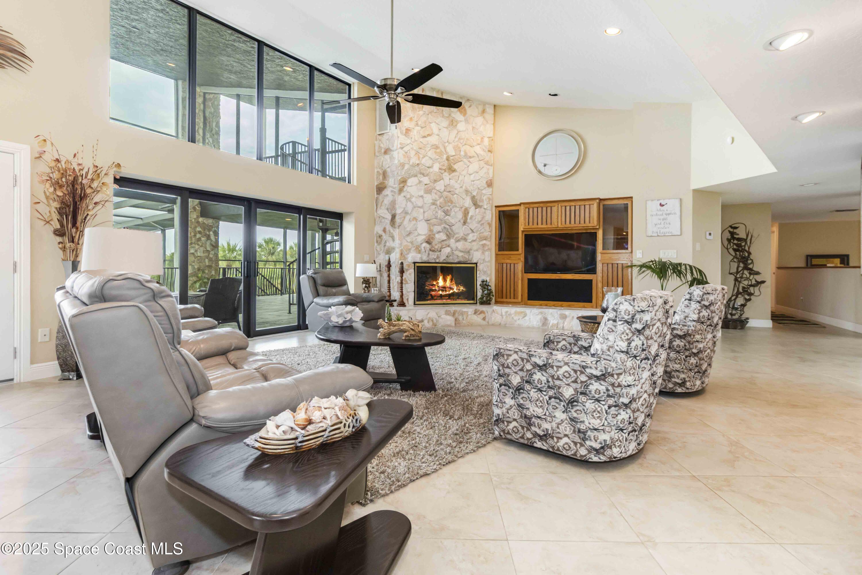 110 Barnacle Place Rockledge, FL 32955 - Photo 8 of 73 a living room with furniture and a fireplace