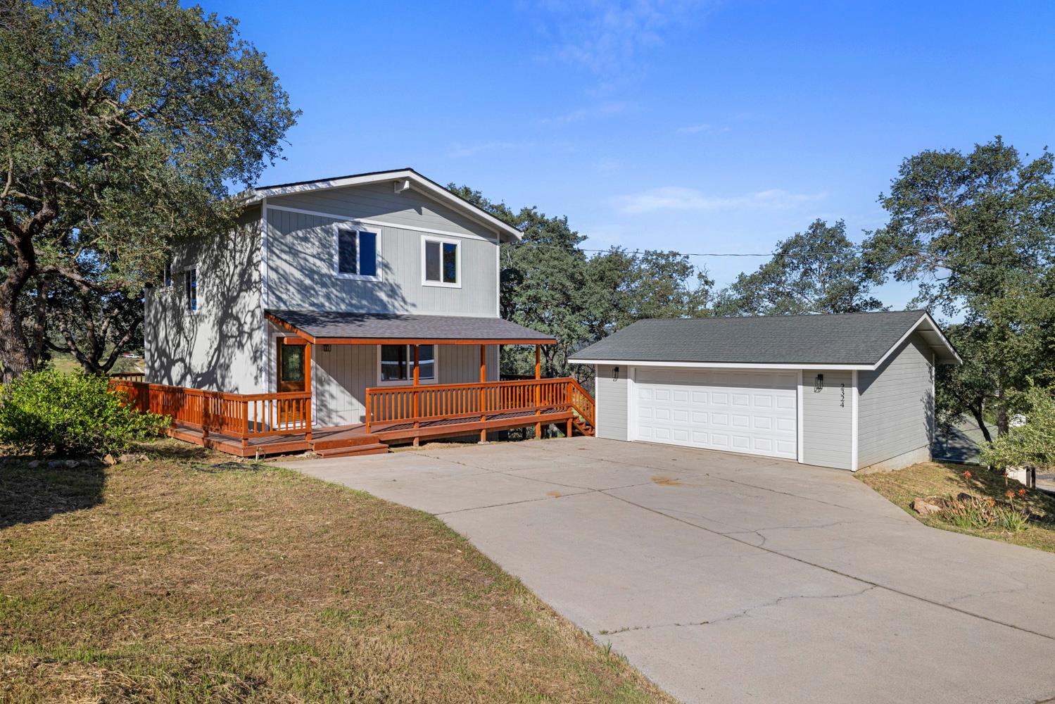 2324 Quail Hill Road Copperopolis, CA 95228 - Photo 2 of 52 a view of house with outdoor space and trees in the background