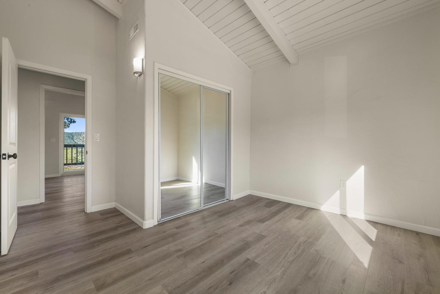 2324 Quail Hill Road Copperopolis, CA 95228 - Photo 36 of 52 a view of empty room with wooden floor