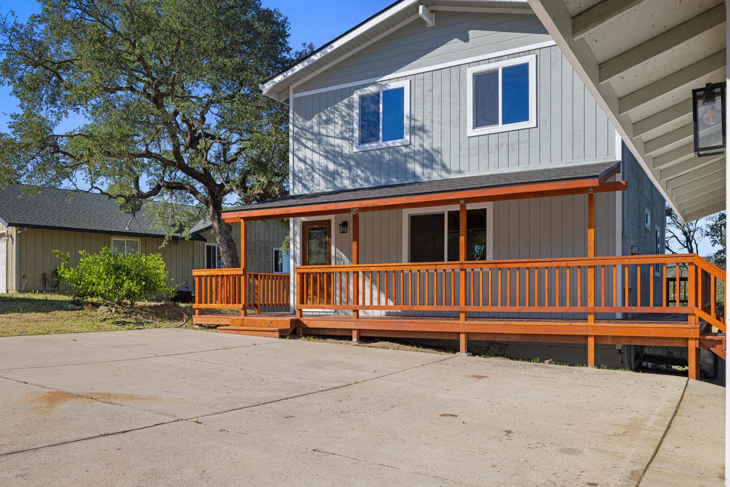 2324 Quail Hill Road Copperopolis, CA 95228 - Photo 47 of 52 a view of a house with a small yard and wooden fence