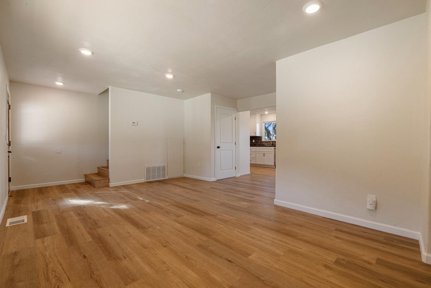 2324 Quail Hill Road Copperopolis, CA 95228 - Photo 7 of 52 a view of empty room with wooden floor