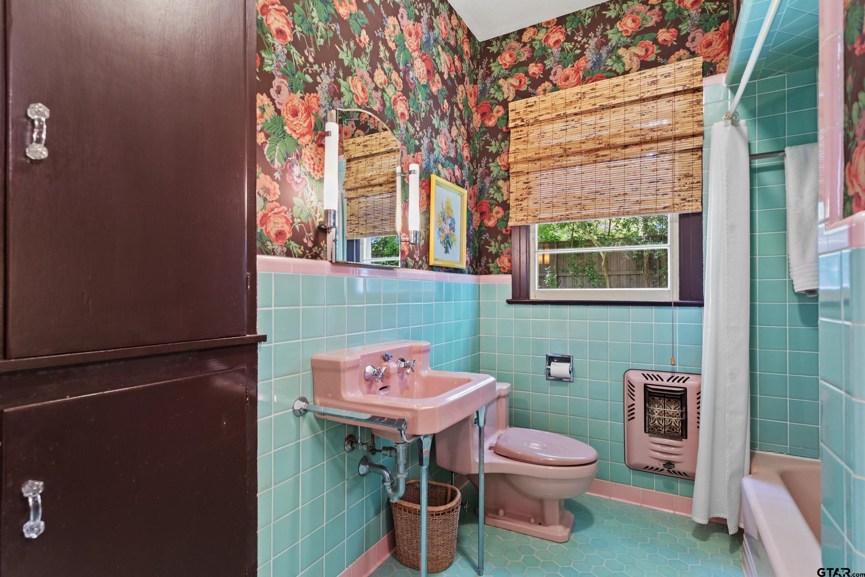 2631 Old Bullard Road Tyler, TX 75701 - Photo 15 of 43 a bathroom with a sink a toilet and a mirror