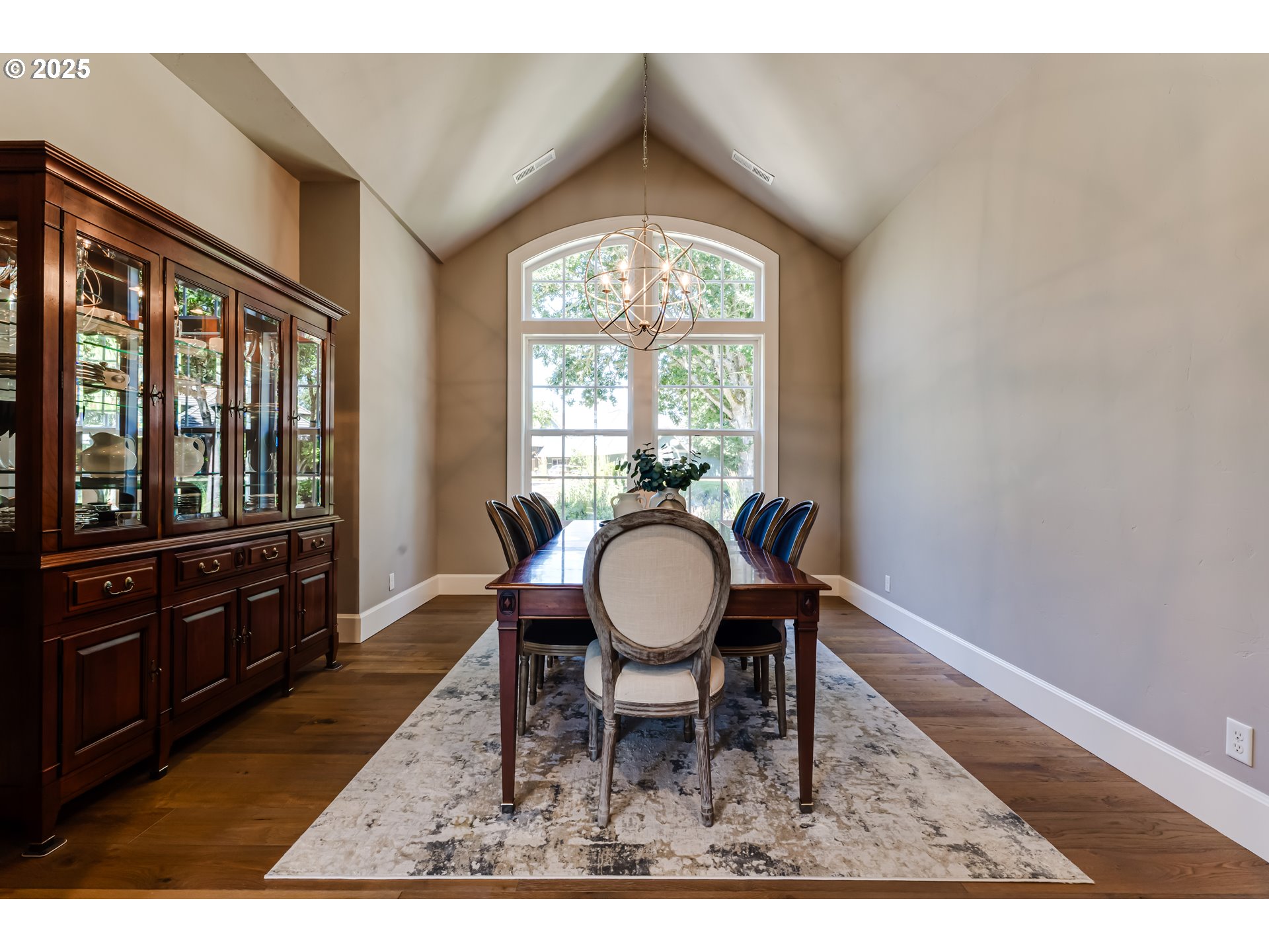 3944 Los Altos Lane Eugene, OR 97405 - Photo 18 of 47 a dining room with wooden floor a glass table and chairs