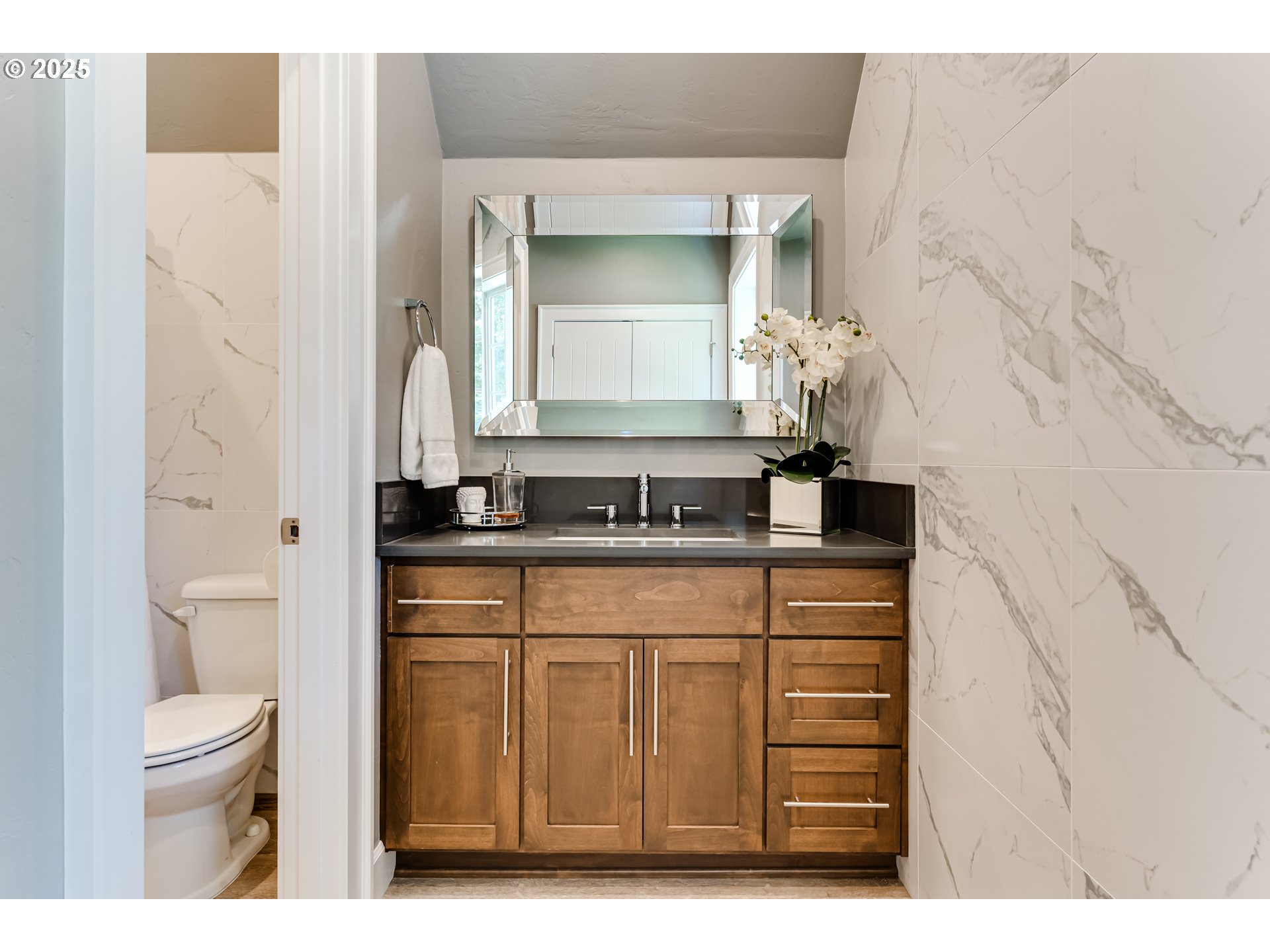 3944 Los Altos Lane Eugene, OR 97405 - Photo 34 of 47 a bathroom with a sink a toilet and a mirror