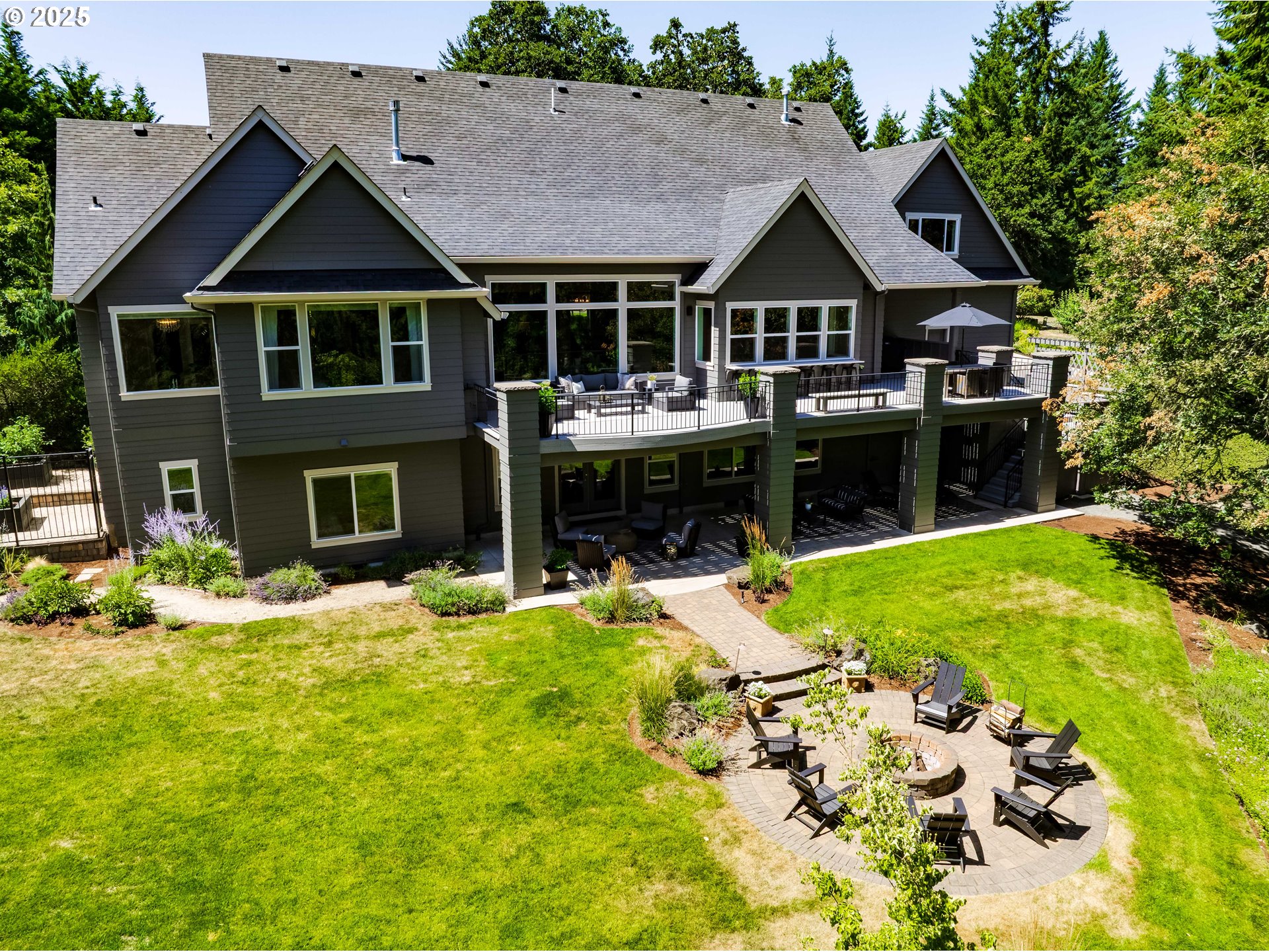 3944 Los Altos Lane Eugene, OR 97405 - Photo 42 of 47 a front view of a house with a yard patio and fire pit
