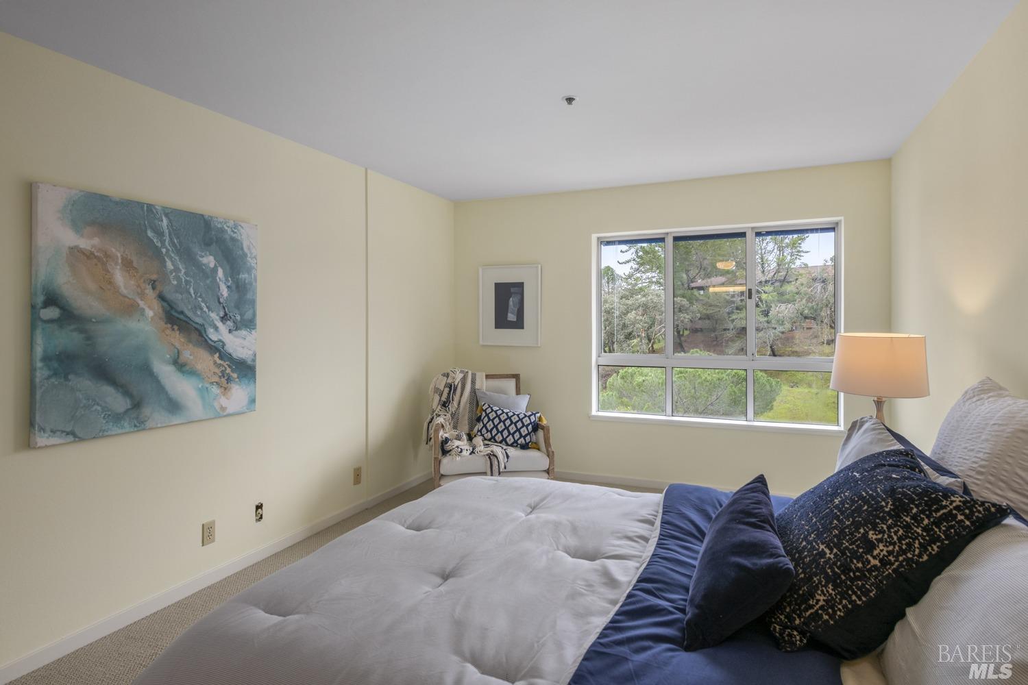 100 Thorndale Drive, Unit 303 San Rafael, CA 94903 - Photo 13 of 32 a bed room with a bed and a window