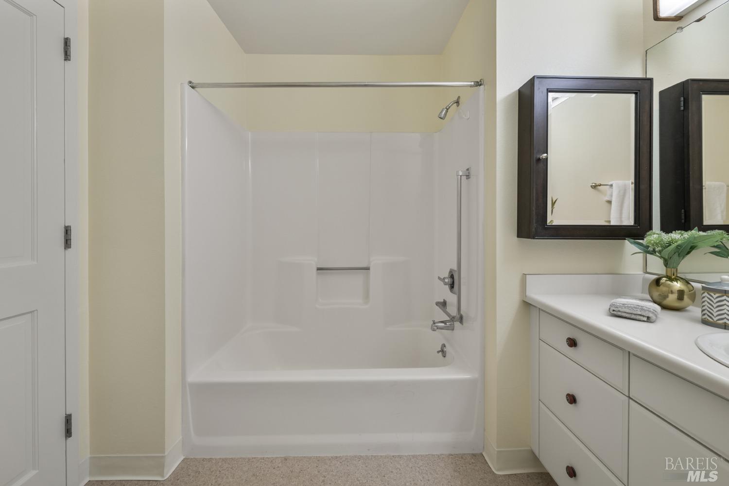 100 Thorndale Drive, Unit 303 San Rafael, CA 94903 - Photo 17 of 32 a bathroom with a tub shower vanity and a sink