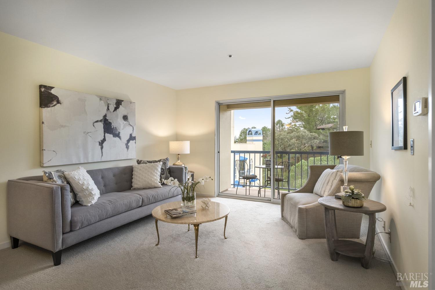 100 Thorndale Drive, Unit 303 San Rafael, CA 94903 - Photo 2 of 32 a living room with furniture and a large window