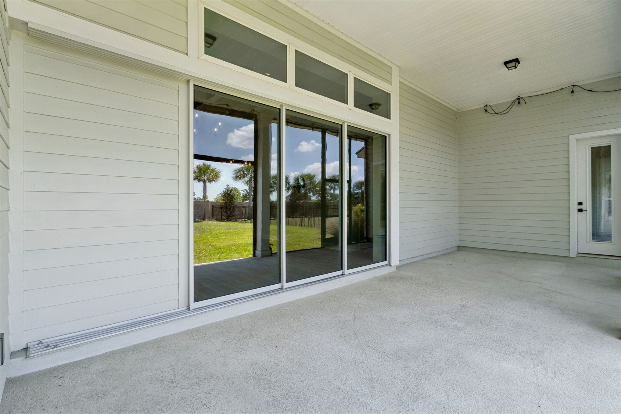 95169 Poplar Way Fernandina Beach, FL 32034 - Photo 19 of 25 a view of an empty room with sliding glass door