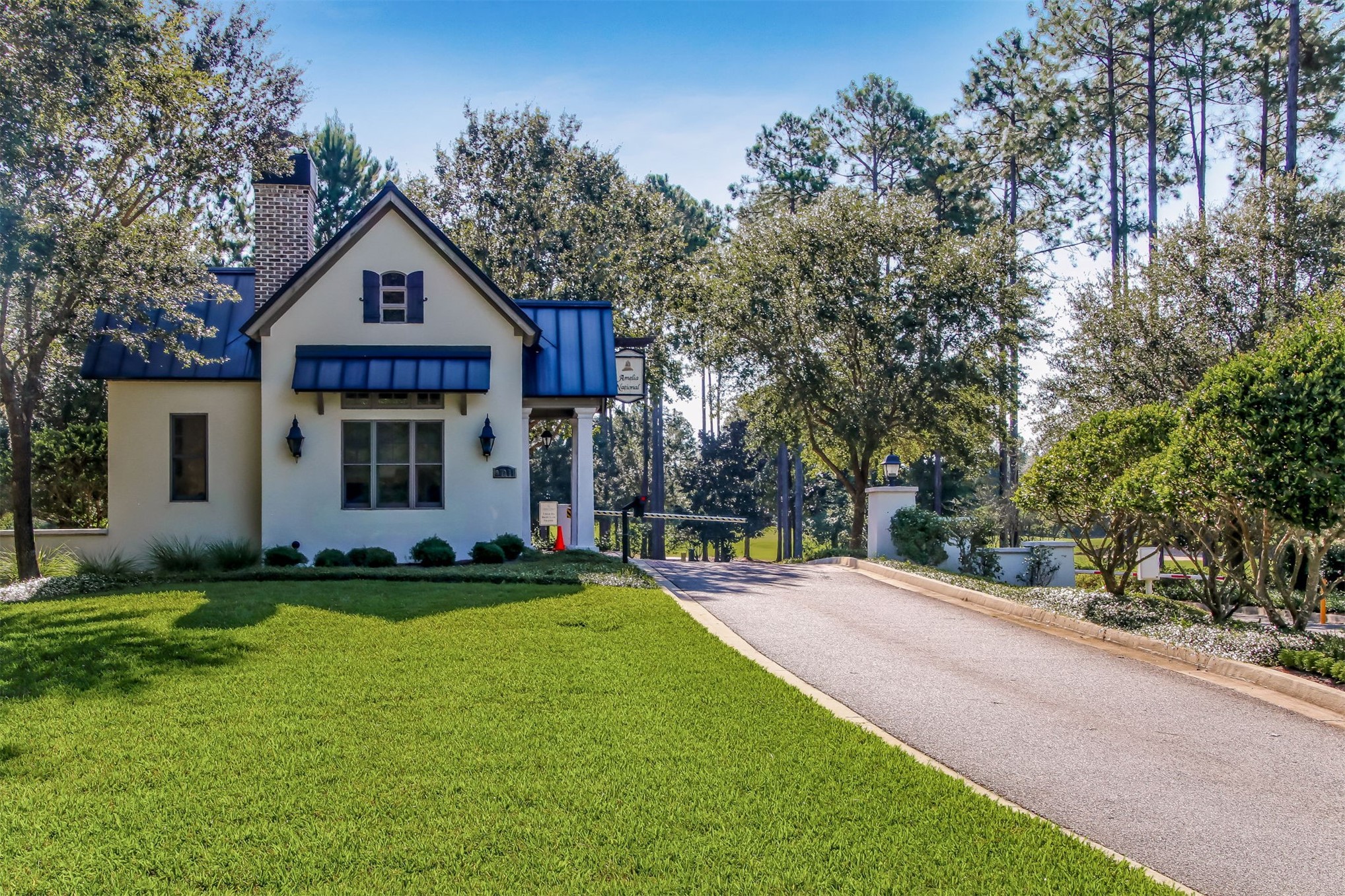 95169 Poplar Way Fernandina Beach, FL 32034 - Photo 22 of 25 a front view of a house with a yard and garage