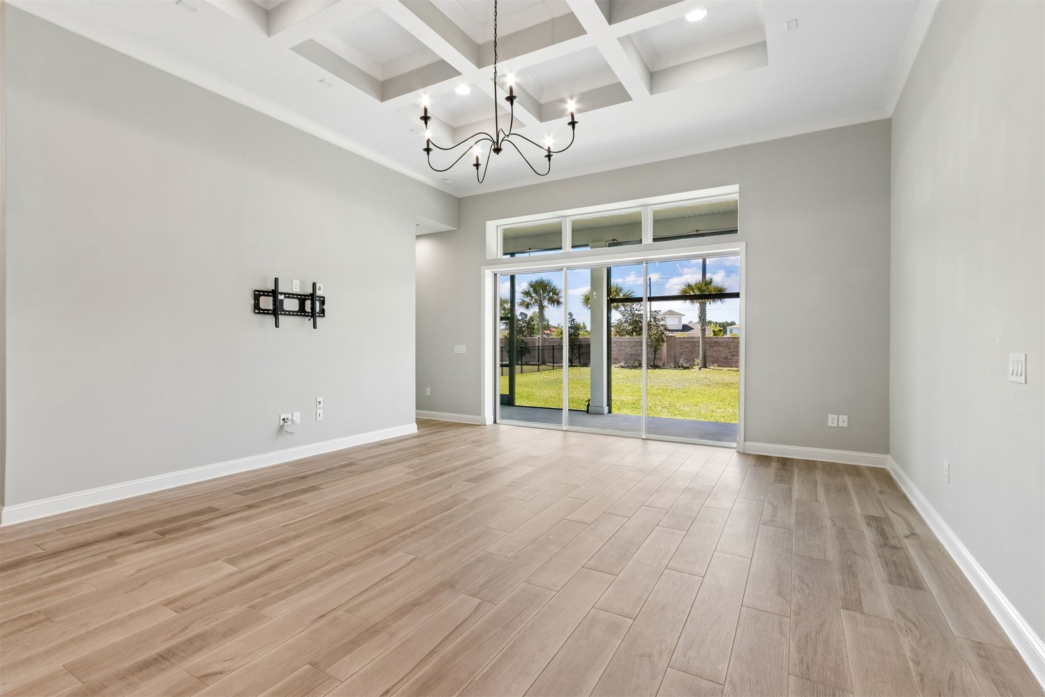95169 Poplar Way Fernandina Beach, FL 32034 - Photo 3 of 25 an empty room with wooden floor and windows