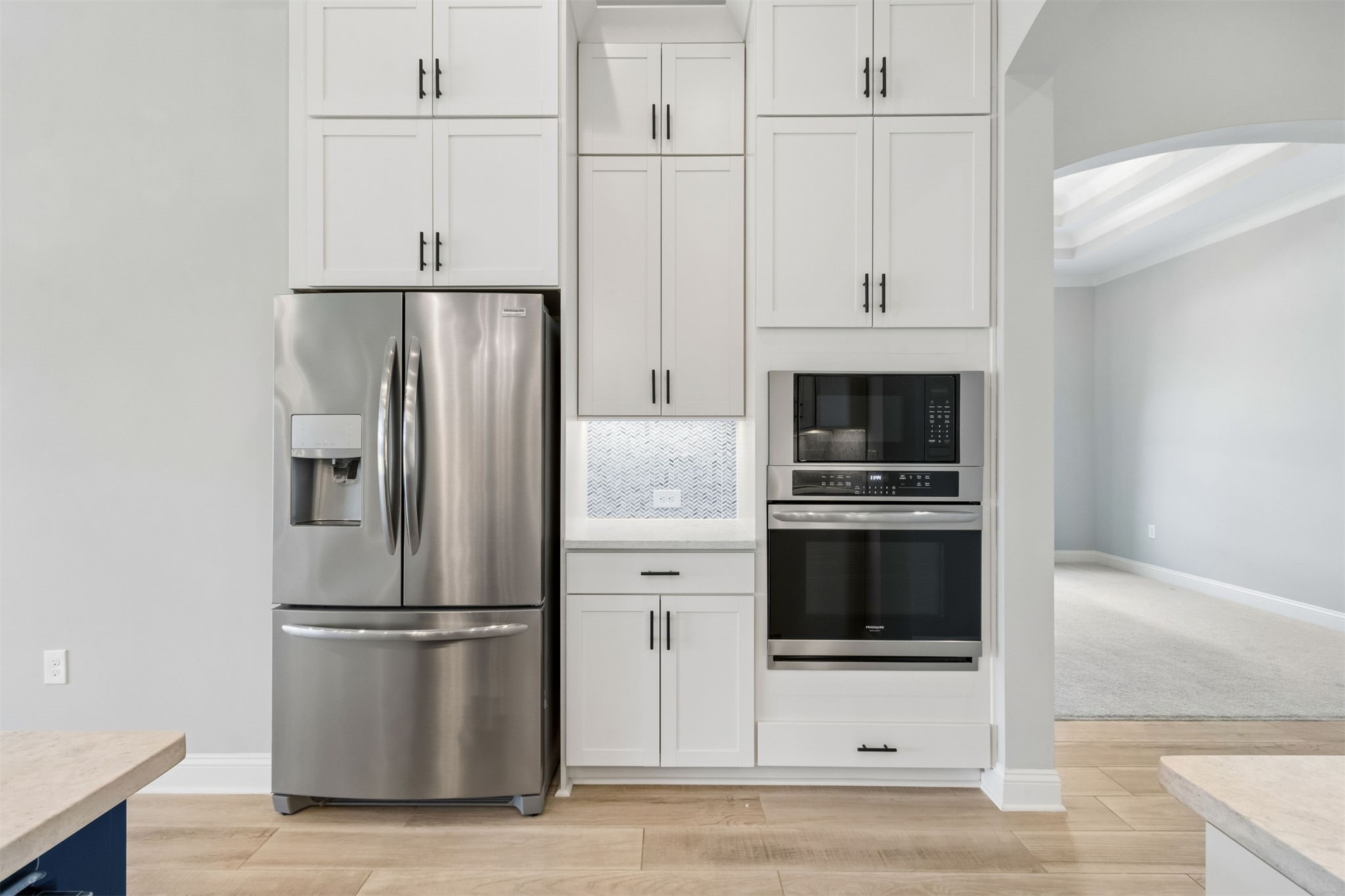 95169 Poplar Way Fernandina Beach, FL 32034 - Photo 6 of 25 a kitchen with stainless steel appliances a refrigerator a stove and white cabinets