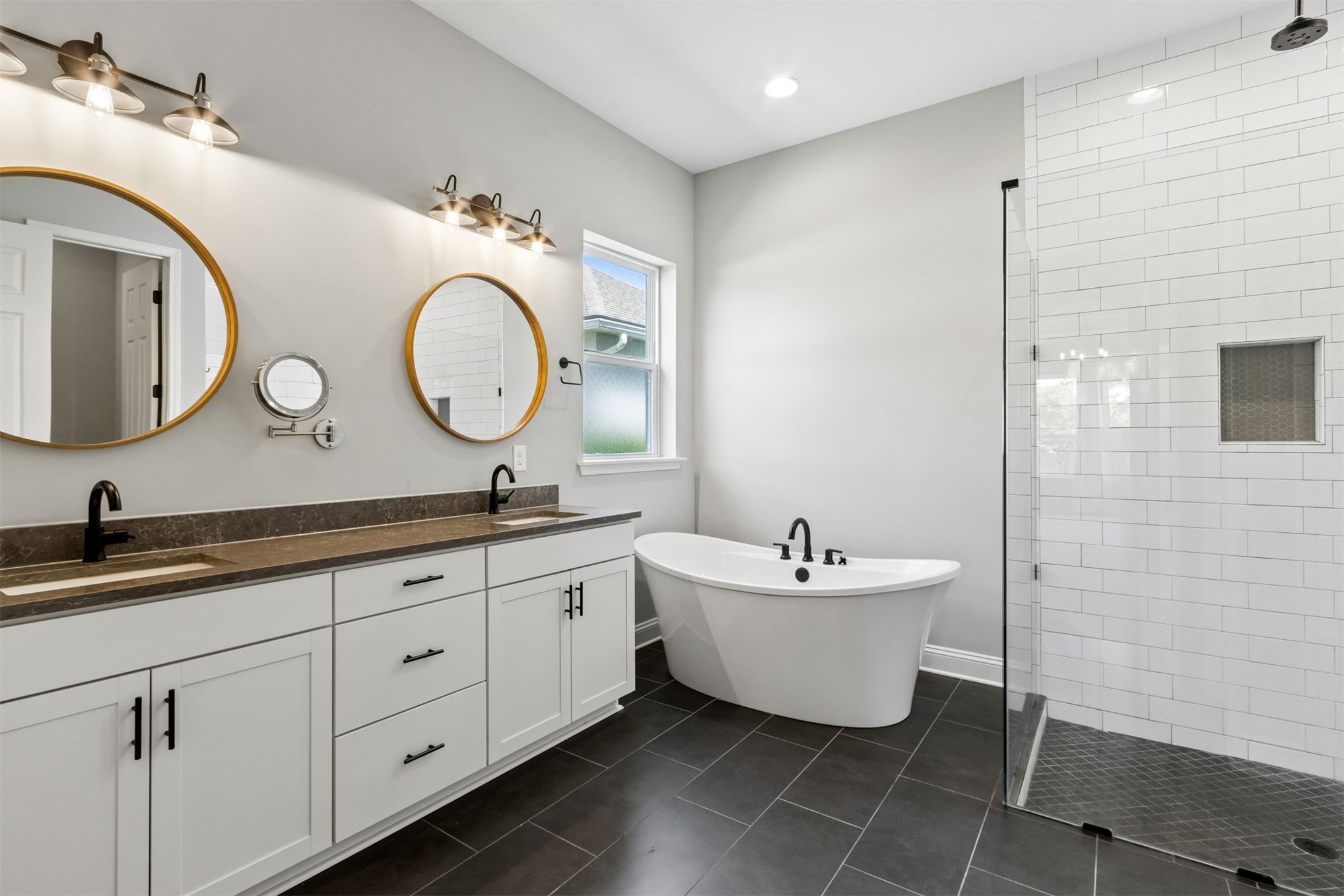 95169 Poplar Way Fernandina Beach, FL 32034 - Photo 8 of 25 a spacious bathroom with a double vanity sink and a mirror