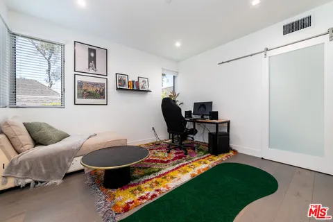 a bathroom with a toilet sink and shower