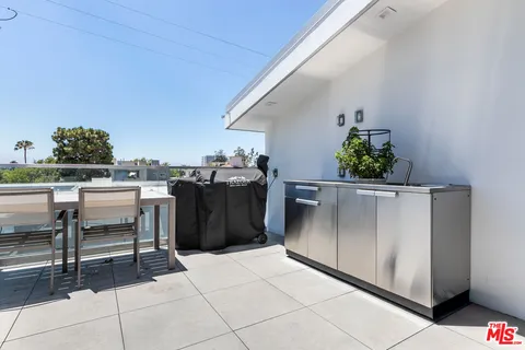 a view of a terrace with furniture and garden