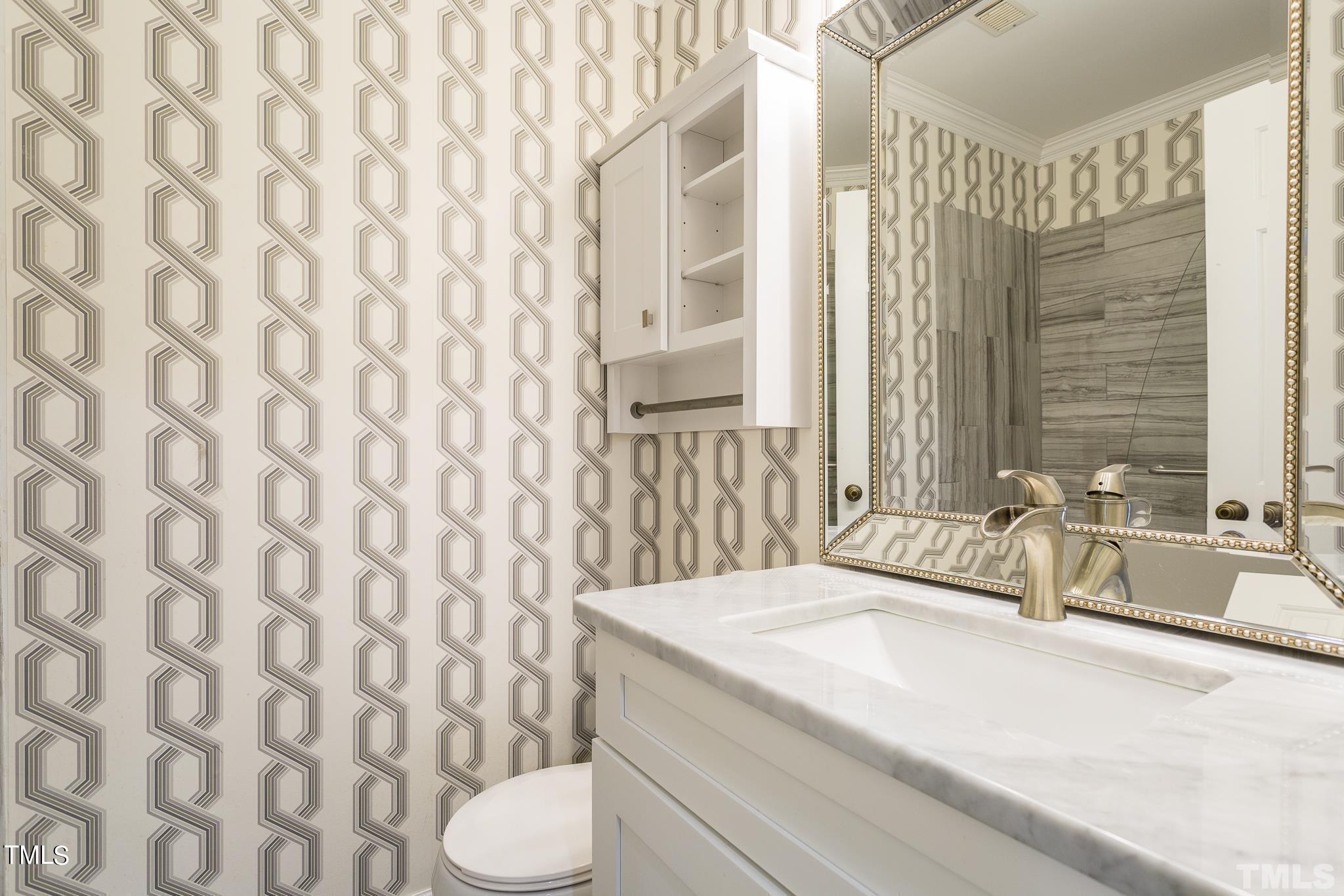 4424 Roller Court Raleigh, NC 27604 - Photo 12 of 19 a bathroom with a granite countertop sink and a mirror