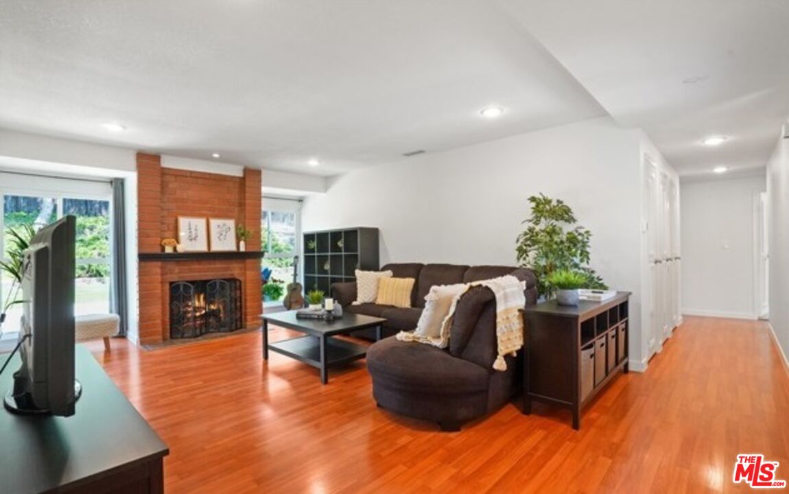 2590 Scott Place Thousand Oaks, CA 91360 - Photo 2 of 12 a living room with furniture and a fireplace