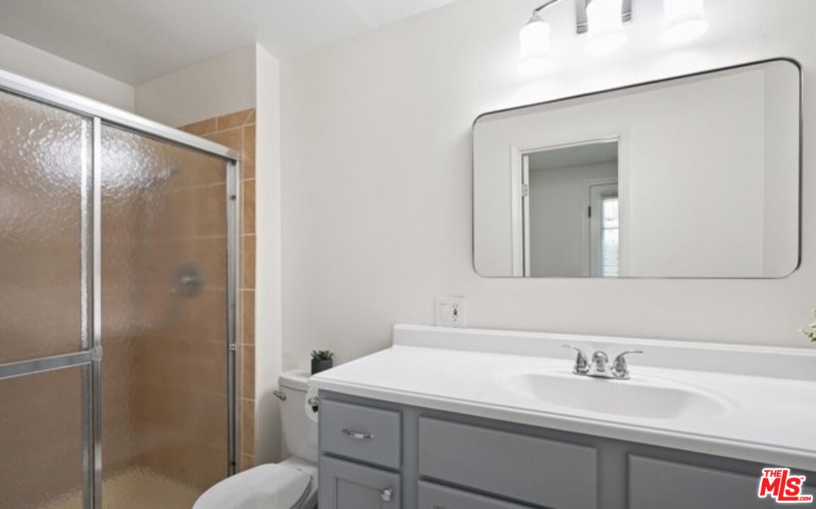 2590 Scott Place Thousand Oaks, CA 91360 - Photo 5 of 12 a bathroom with a sink and mirror with toilet