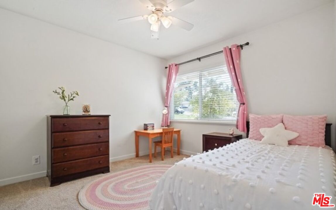 2590 Scott Place Thousand Oaks, CA 91360 - Photo 7 of 12 a bedroom with a bed and a window