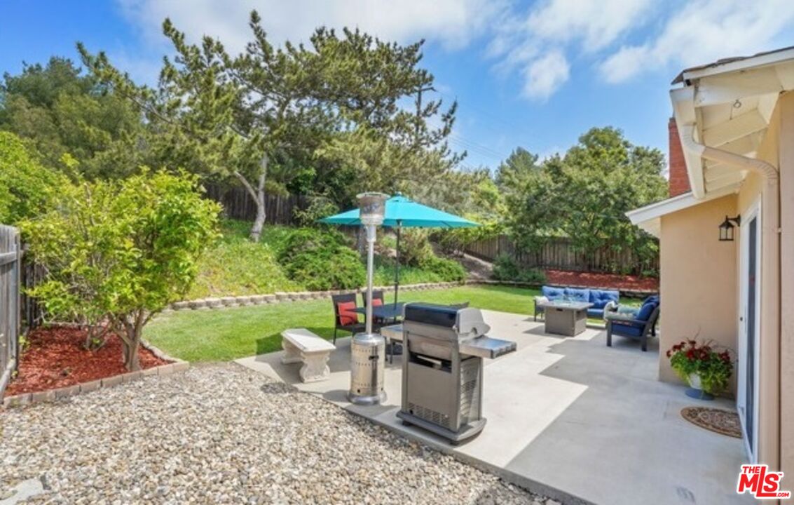 2590 Scott Place Thousand Oaks, CA 91360 - Photo 10 of 12 a view of a patio with couches chairs and a yard