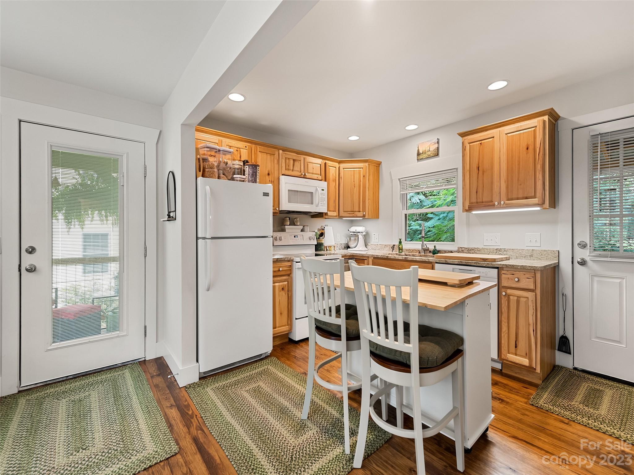 472 County Road Lake Junaluska, NC 28745 - Photo 10 of 26 a kitchen with granite countertop appliances a sink and a refrigerator
