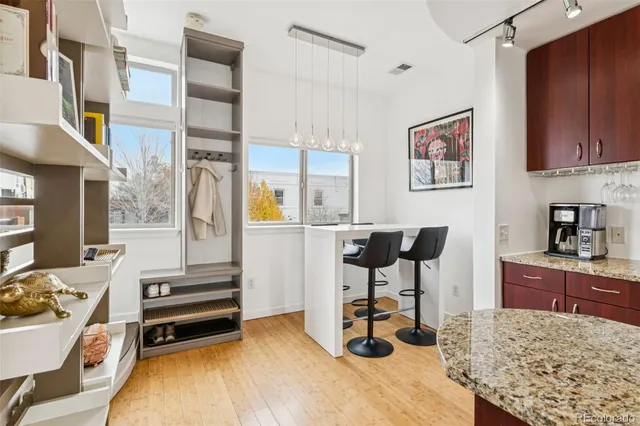 a view of a kitchen with workspace and a window
