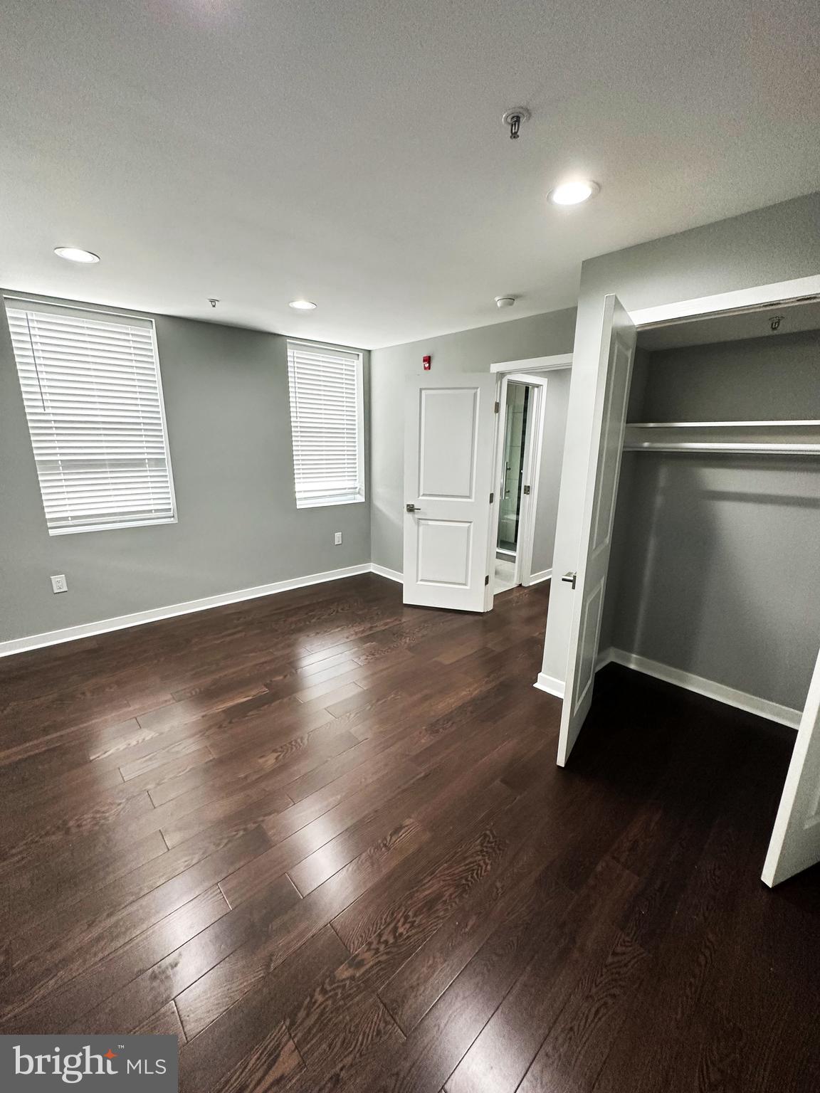 1801 West Venango Street, Unit 3 Philadelphia, PA 19140 - Photo 11 of 22 an empty room with wooden floor and windows