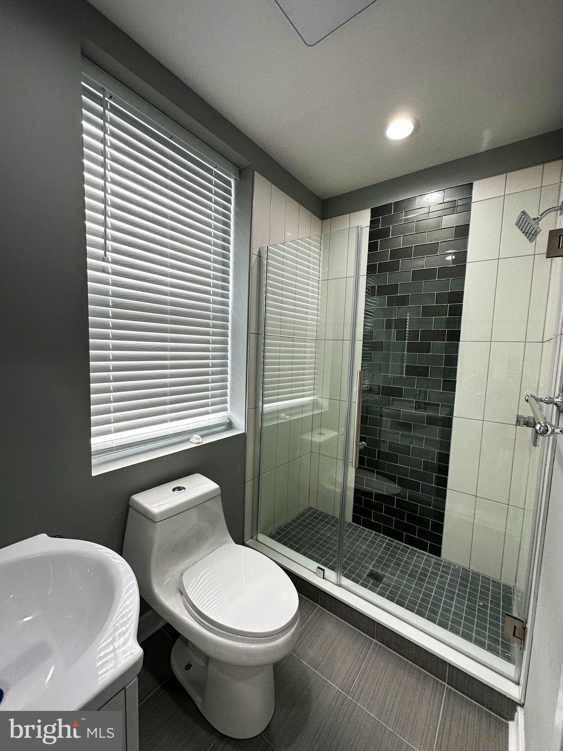 1801 West Venango Street, Unit 3 Philadelphia, PA 19140 - Photo 18 of 22 a bathroom with a sink and a toilet