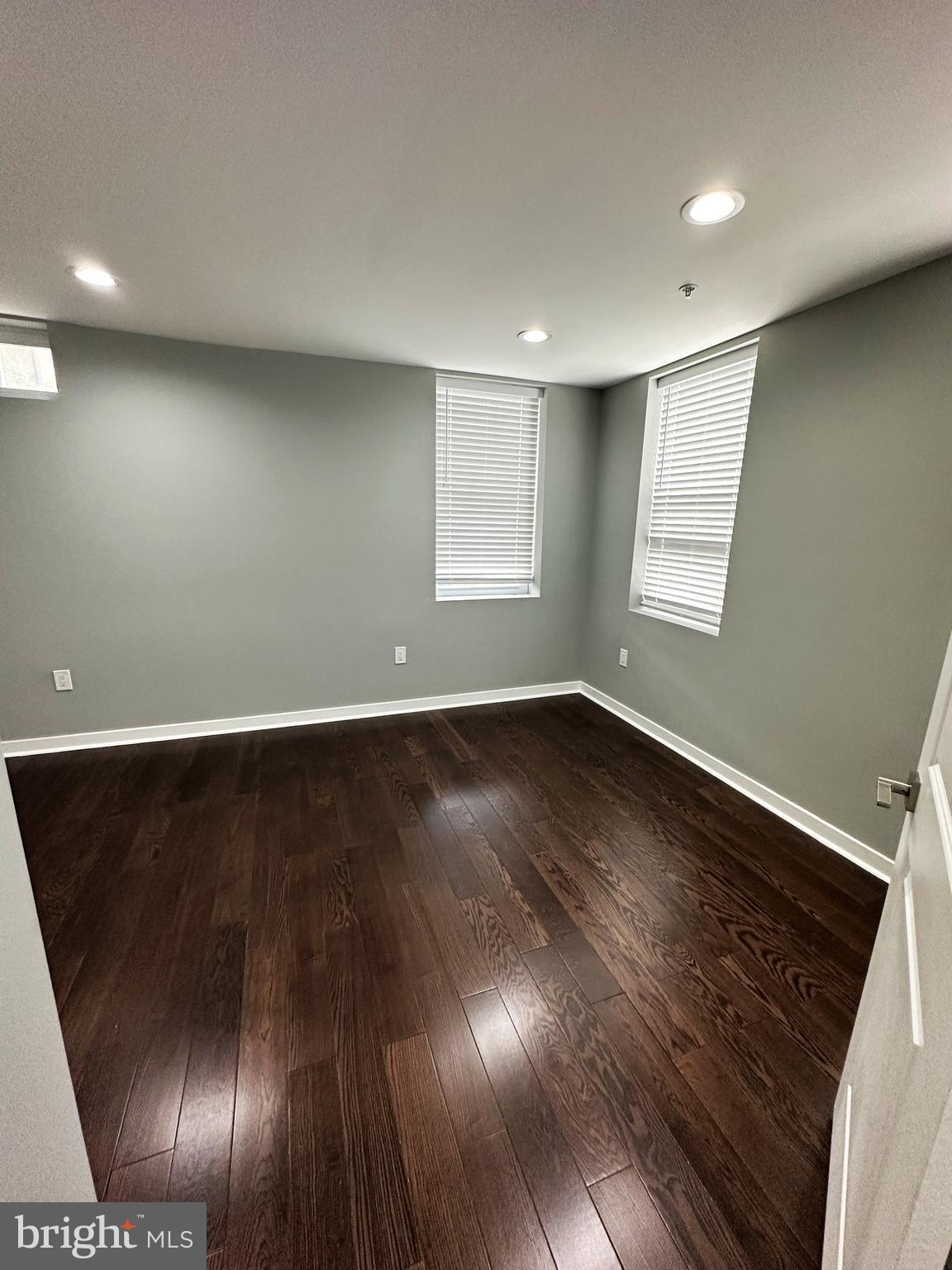 1801 West Venango Street, Unit 3 Philadelphia, PA 19140 - Photo 7 of 22 an empty room with wooden floor and windows