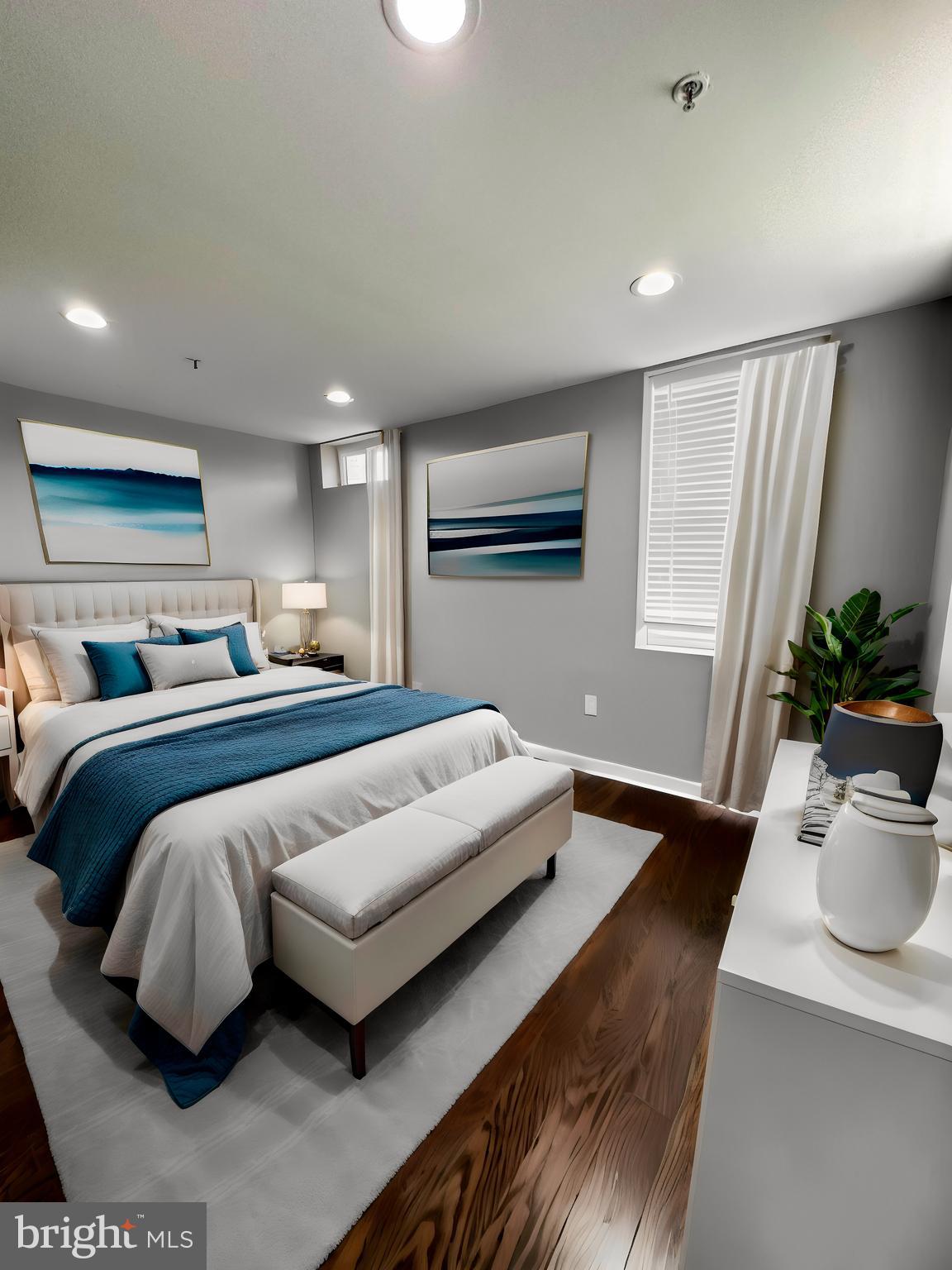 1801 West Venango Street, Unit 3 Philadelphia, PA 19140 - Photo 10 of 22 a bedroom with a large bed and a potted plant