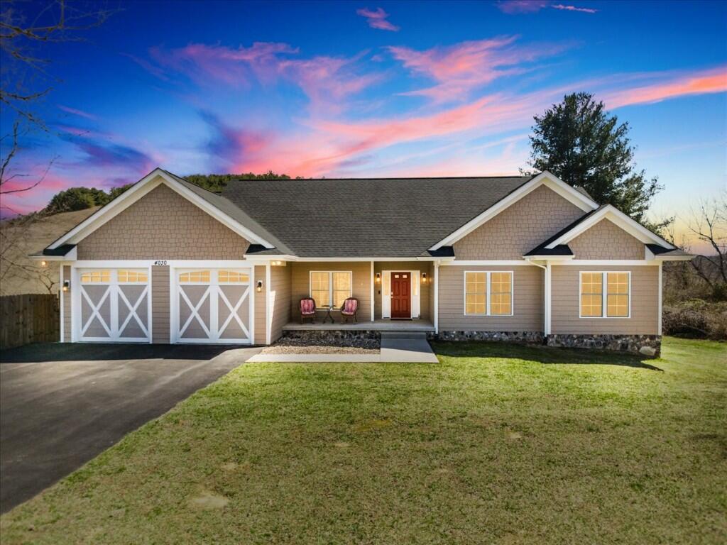 4030 Old Baltimore Road Draper, VA 24324 - Photo 1 of 105 a front view of a house with a yard