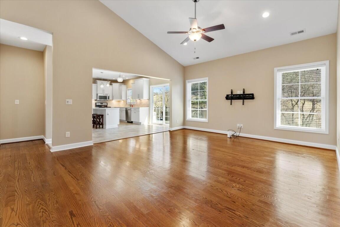 4030 Old Baltimore Road Draper, VA 24324 - Photo 12 of 105 a view of an empty room with wooden floor and a window