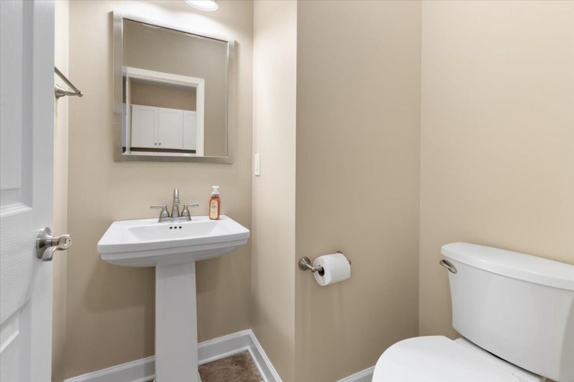 4030 Old Baltimore Road Draper, VA 24324 - Photo 27 of 105 a bathroom with a sink toilet and mirror