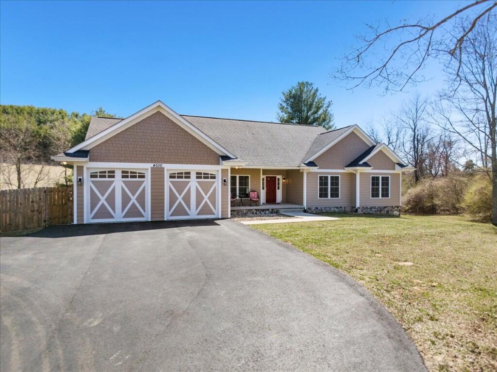 4030 Old Baltimore Road Draper, VA 24324 - Photo 4 of 105 a front view of a house with a yard