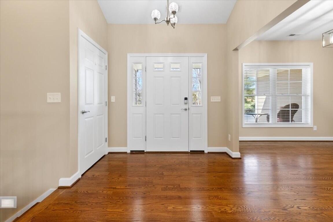 4030 Old Baltimore Road Draper, VA 24324 - Photo 7 of 105 a view of an empty room with wooden floor and a window