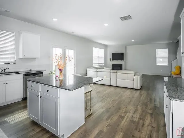 a kitchen with sink and cabinets