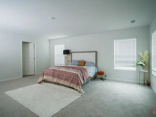 a bathroom with a double vanity sink and mirror