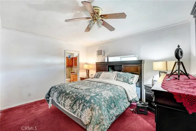 a bathroom with a granite countertop sink mirror vanity and toilet