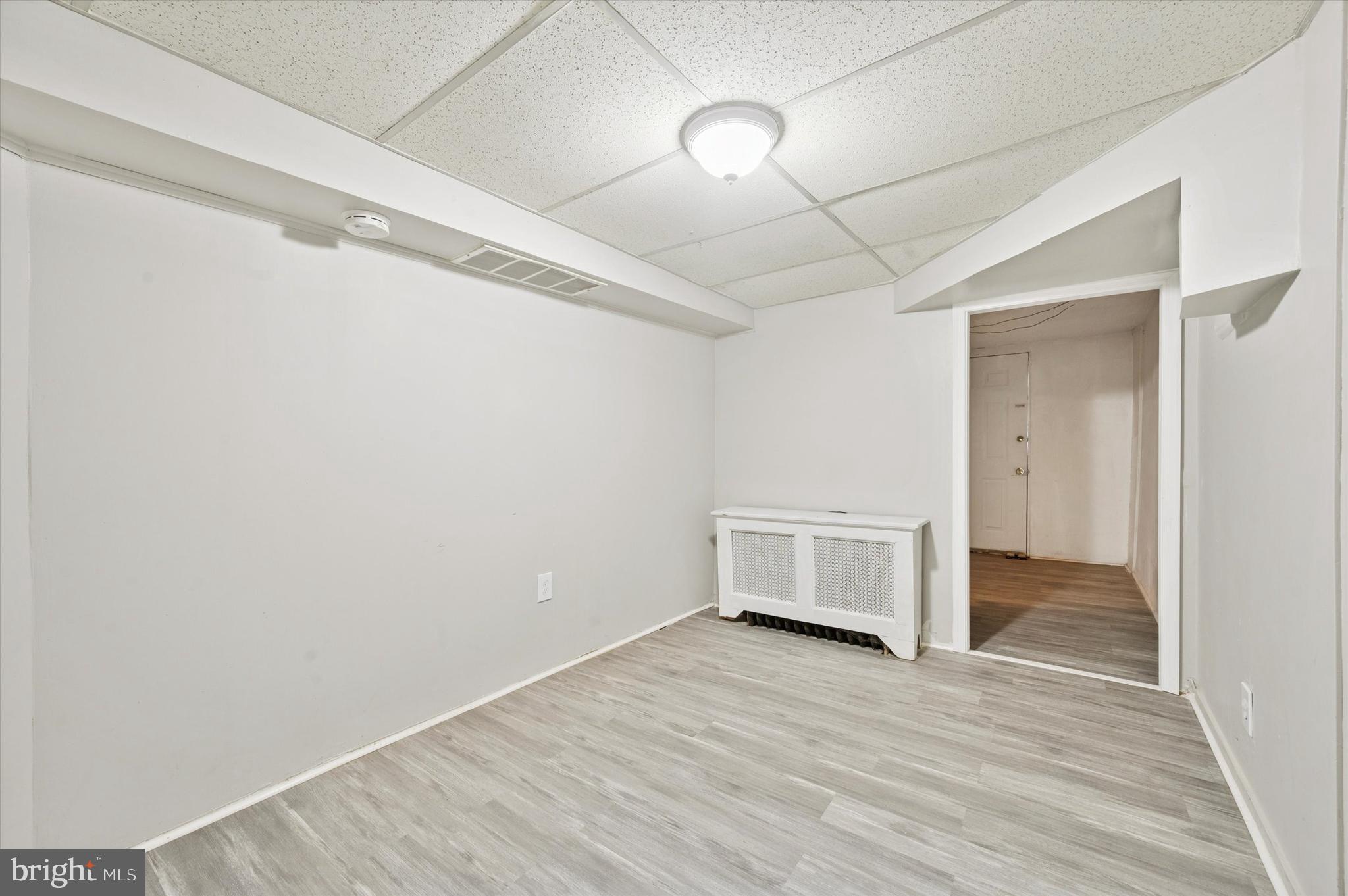 6619 Guyer Avenue, Unit 1 Philadelphia, PA 19142 - Photo 11 of 16 a view of empty room with wooden floor